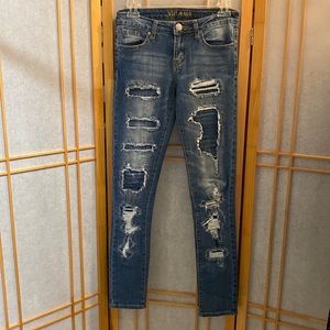 Distressed V I P Skinny Jeans